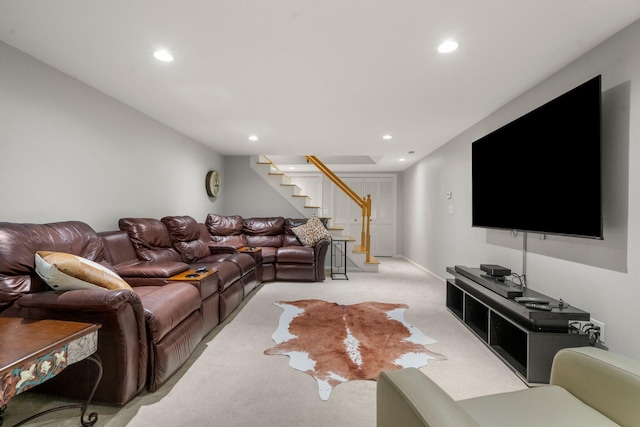 living area featuring stairs, recessed lighting, and light carpet