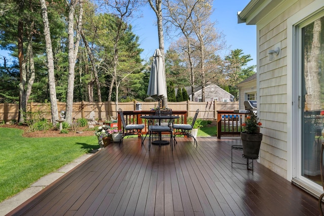 deck with outdoor dining area