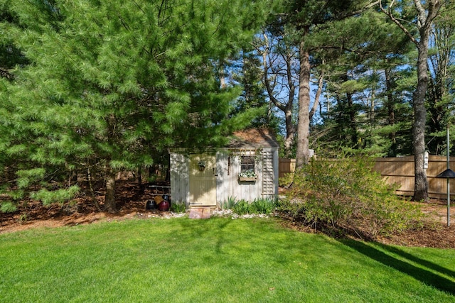 view of yard featuring a shed and an outdoor structure