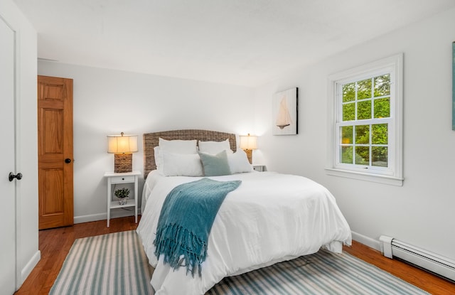 4 Frank Doyle Rd, South Dennis, MA 02660 - bedroom with baseboard heating, baseboards, and wood finished floors