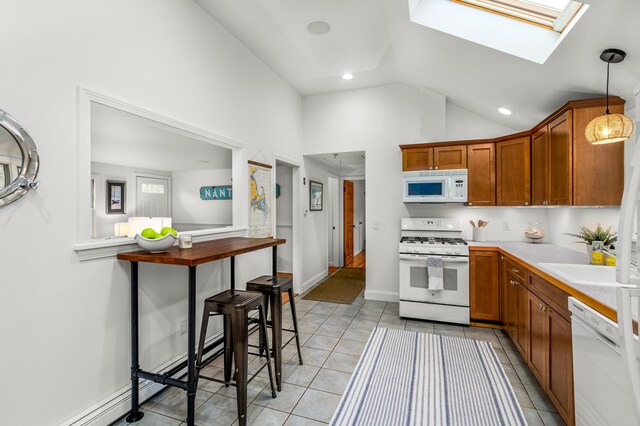 4 Frank Doyle Rd, South Dennis, MA 02660 - kitchen with white appliances, a skylight, light tile patterned flooring, light countertops, and recessed lighting