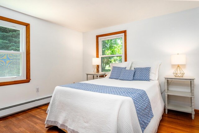 2 Pine Ridge End, Truro, MA 02666 - bedroom featuring baseboard heating, multiple windows, and wood finished floors