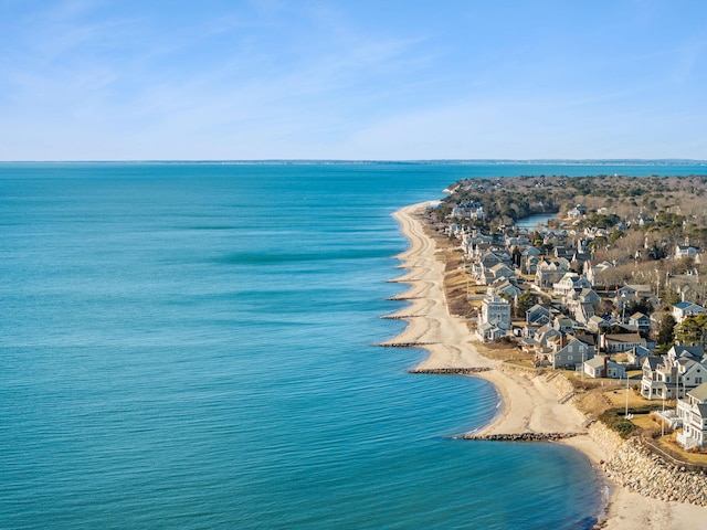 bird's eye view featuring a view of the beach and a water view