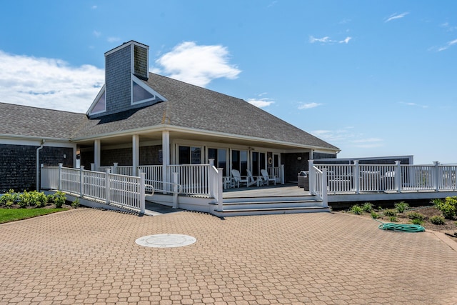 rear view of house with a deck