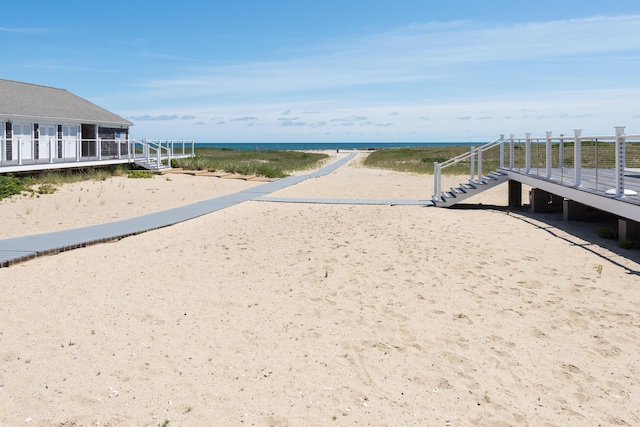 view of community featuring a water view and a view of the beach