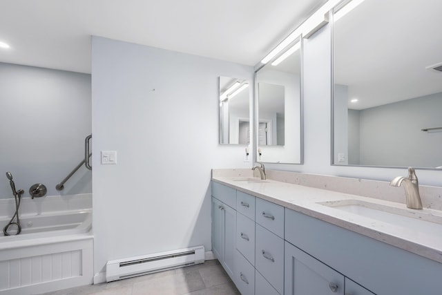 bathroom featuring vanity, a tub to relax in, a baseboard radiator, and tile patterned flooring