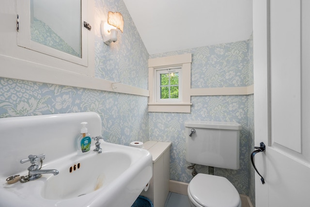 73 Division St, West Harwich, MA 02671 - bathroom featuring vaulted ceiling and wallpapered walls
