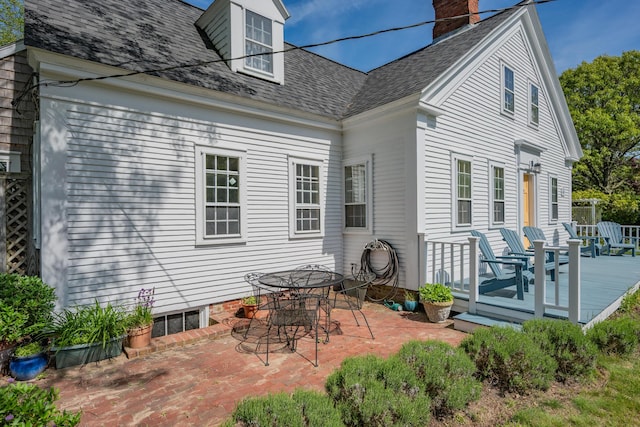 73 Division St, West Harwich, MA 02671 - rear view of property with a patio area, a wooden deck, roof with shingles, and outdoor dining area