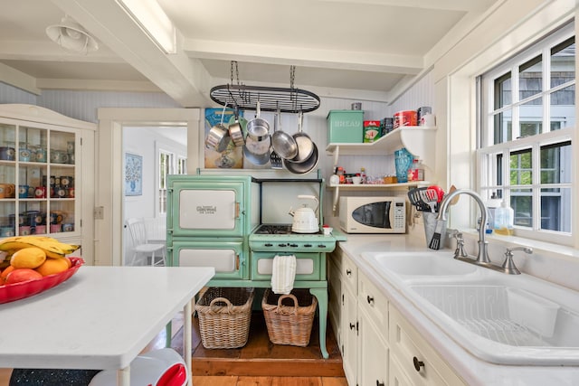 73 Division St, West Harwich, MA 02671 - laundry room featuring healthy amount of natural light and wood finished floors