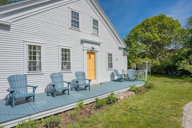 73 Division St, West Harwich, MA 02671 - rear view of property with a yard and a wooden deck