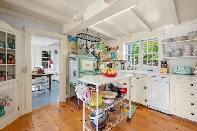 73 Division St, West Harwich, MA 02671 - kitchen with dishwasher, open shelves, beamed ceiling, light wood-type flooring, and light countertops