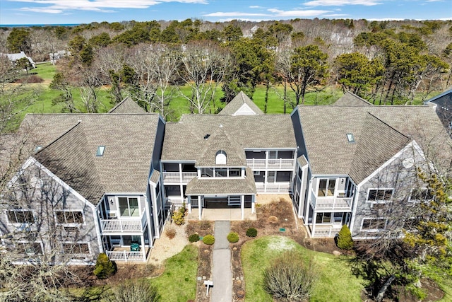 82 Fletcher Ln Unit D, Brewster, MA 02631 - aerial view of property and surrounding area with a tree filled landscape