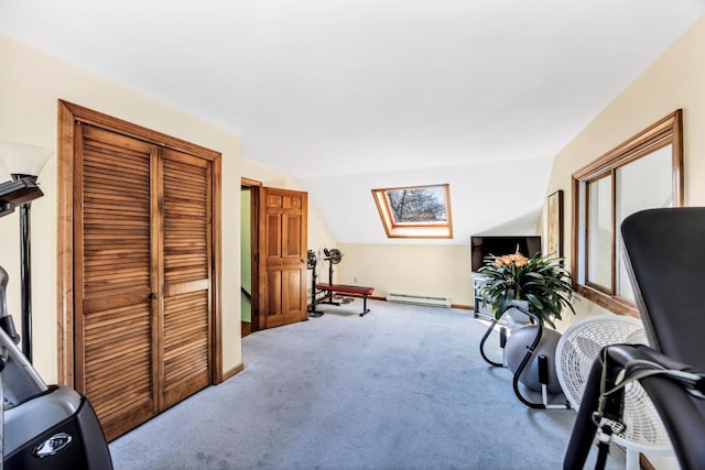 carpeted office featuring a baseboard radiator, a skylight, vaulted ceiling, and baseboards