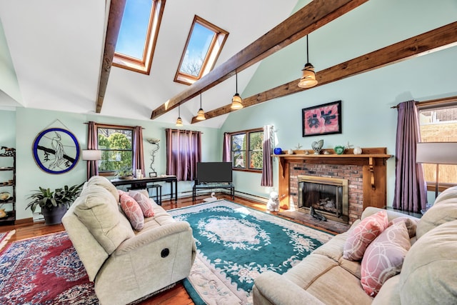 living room with a skylight, beam ceiling, high vaulted ceiling, a brick fireplace, and baseboards