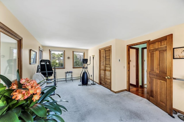 workout room with carpet floors and baseboards