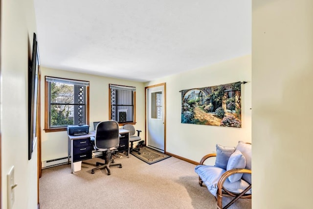 home office featuring carpet floors, a baseboard heating unit, and baseboards