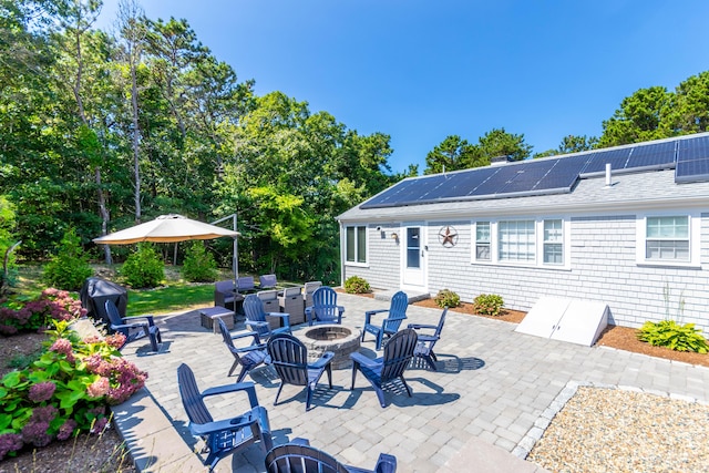 view of patio / terrace featuring an outdoor fire pit