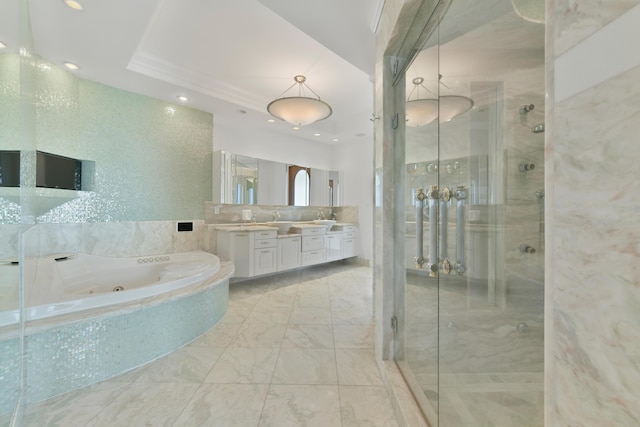 bathroom with ornamental molding, independent shower and bath, and vanity