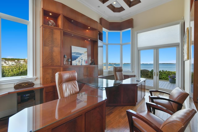 office with crown molding, french doors, hardwood / wood-style flooring, a water view, and coffered ceiling