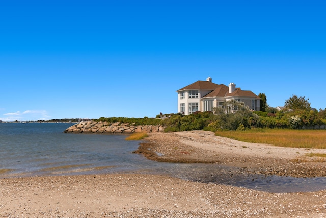 view of front facade with a water view