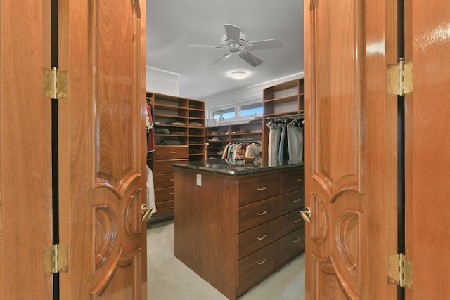 spacious closet with ceiling fan