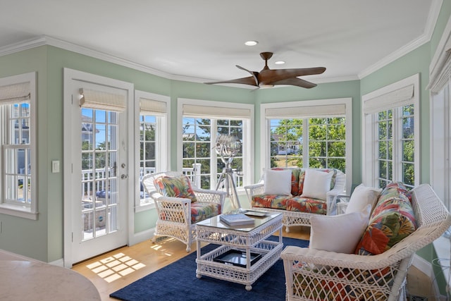 sunroom featuring ceiling fan