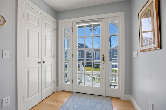 doorway with light hardwood / wood-style floors