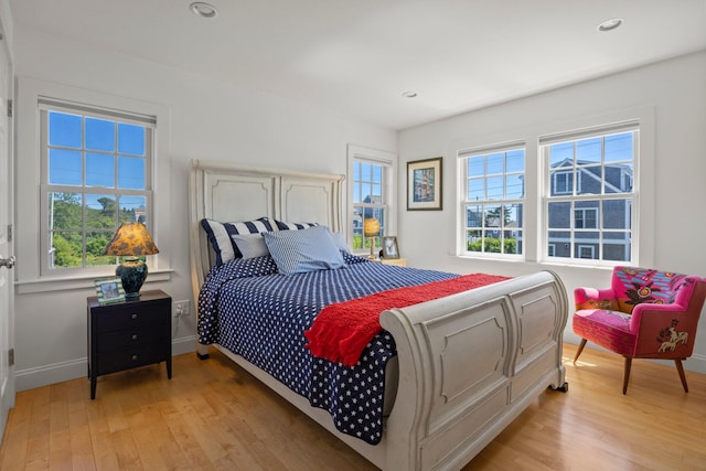 bedroom with light wood-type flooring