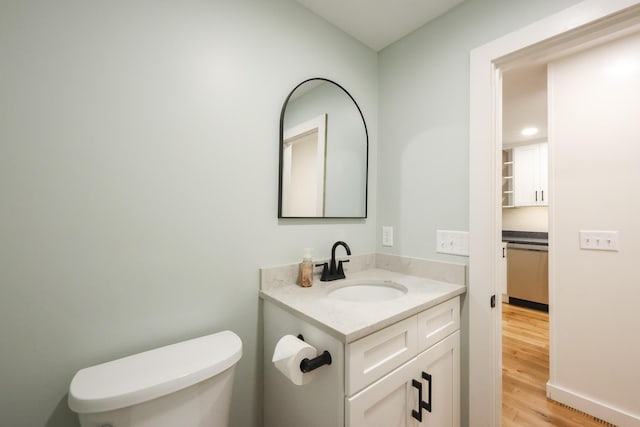 300 Buck Island Rd Unit C13F, West Yarmouth, MA 02673 - half bath featuring vanity, toilet, and wood finished floors