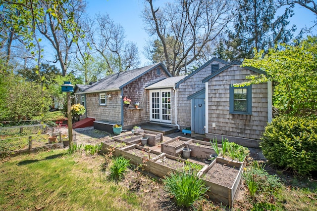 back of house with an outdoor structure