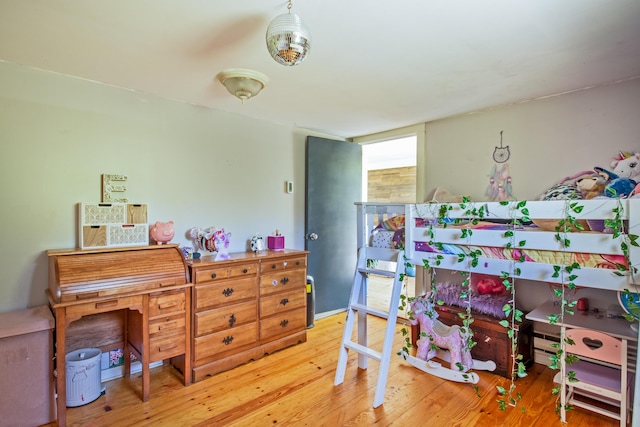 bedroom with hardwood / wood-style floors