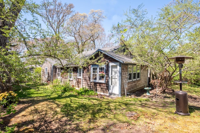 view of outbuilding featuring a yard