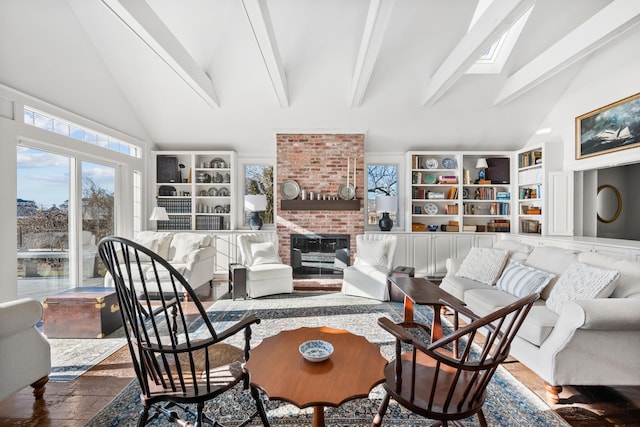17 Harbor Rd, Harwich Port, MA 02646 - living room with a brick fireplace, beamed ceiling, wood finished floors, and high vaulted ceiling