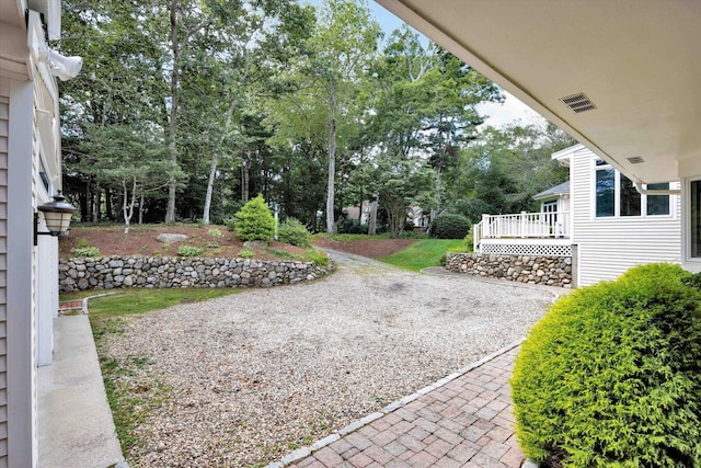 view of yard featuring a deck