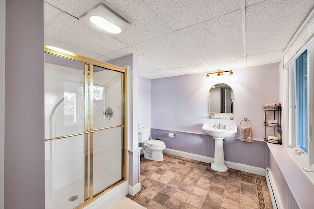 67 Redwood Cir, Mashpee, MA 02649 - bathroom featuring a stall shower, toilet, a drop ceiling, a baseboard radiator, and wainscoting