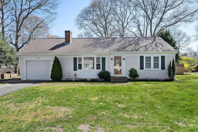 ranch-style house featuring fence, a front lawn, a garage, a chimney, and driveway