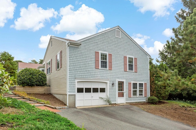 24 Greenland Cir, Yarmouth Port, MA 02675 - view of front of home with driveway and an attached garage