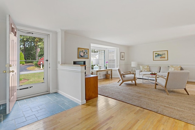 24 Greenland Cir, Yarmouth Port, MA 02675 - entrance foyer featuring plenty of natural light, wood finished floors, and ornamental molding