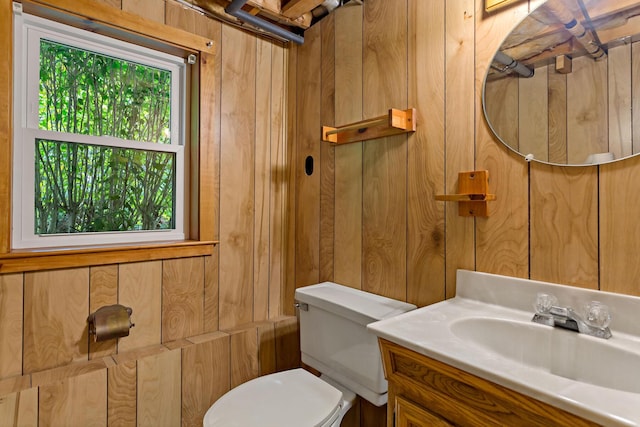 24 Greenland Cir, Yarmouth Port, MA 02675 - half bathroom with wooden walls and vanity