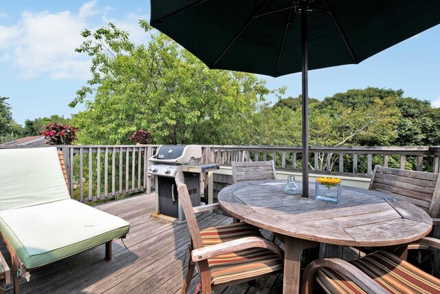 184 Bradford St Unit U1, Provincetown, MA 02657 - wooden deck featuring a grill and outdoor dining area
