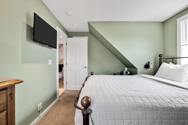 bedroom with light colored carpet