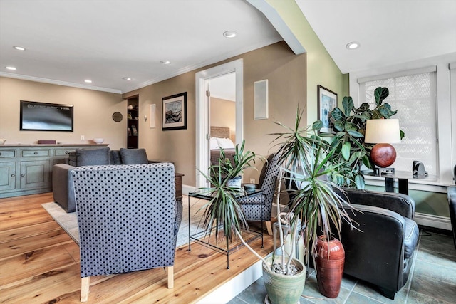 living room featuring crown molding and light wood-type flooring