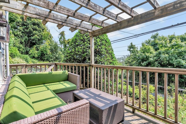 wooden deck with a pergola and outdoor lounge area