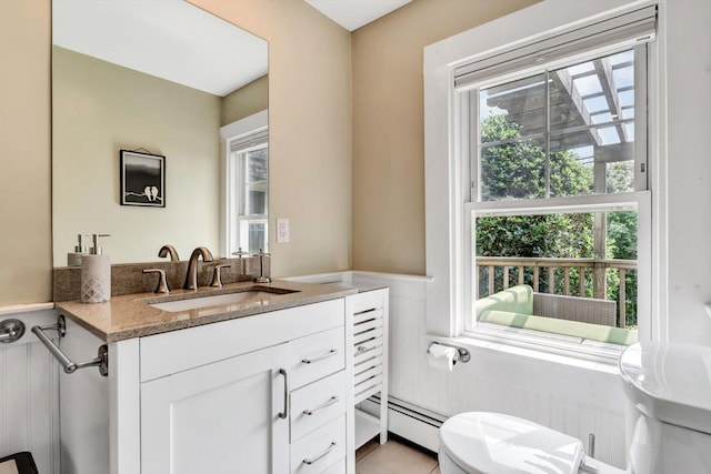 bathroom featuring plenty of natural light and toilet