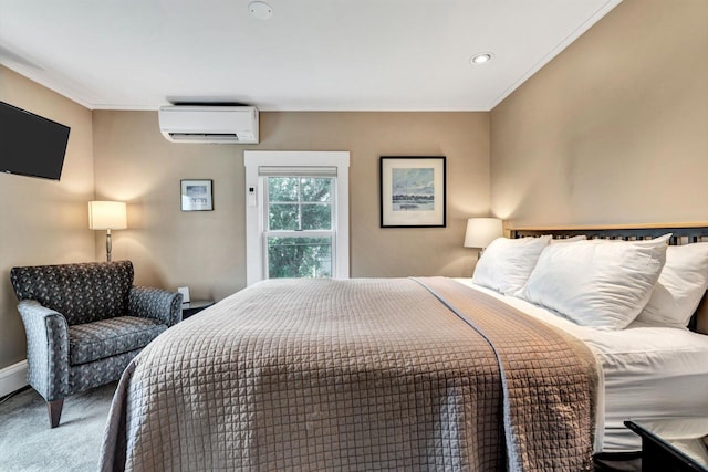 bedroom featuring crown molding, a wall unit AC, and carpet flooring