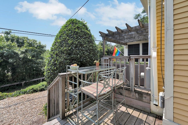 wooden deck featuring a pergola