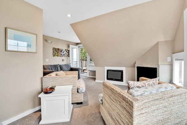 carpeted living room with vaulted ceiling