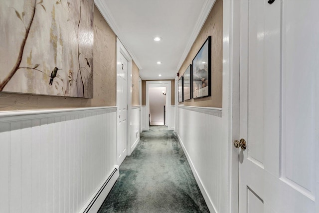 hallway with dark carpet and ornamental molding