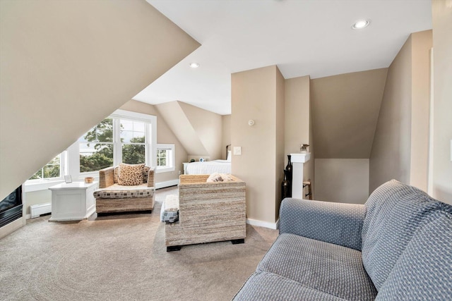 carpeted bedroom featuring a baseboard heating unit and lofted ceiling