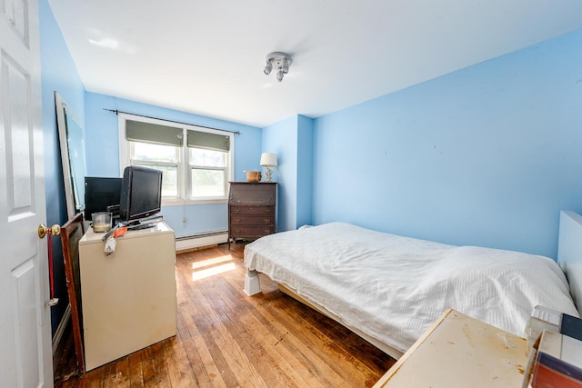 24 Hazelmoor Rd, South Yarmouth, MA 02664 - bedroom featuring a baseboard radiator and hardwood / wood-style flooring